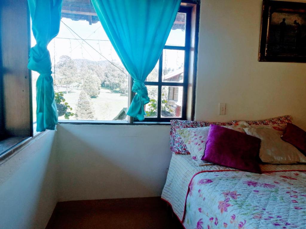Postel nebo postele na pokoji v ubytování Finca Hotel Nutabes