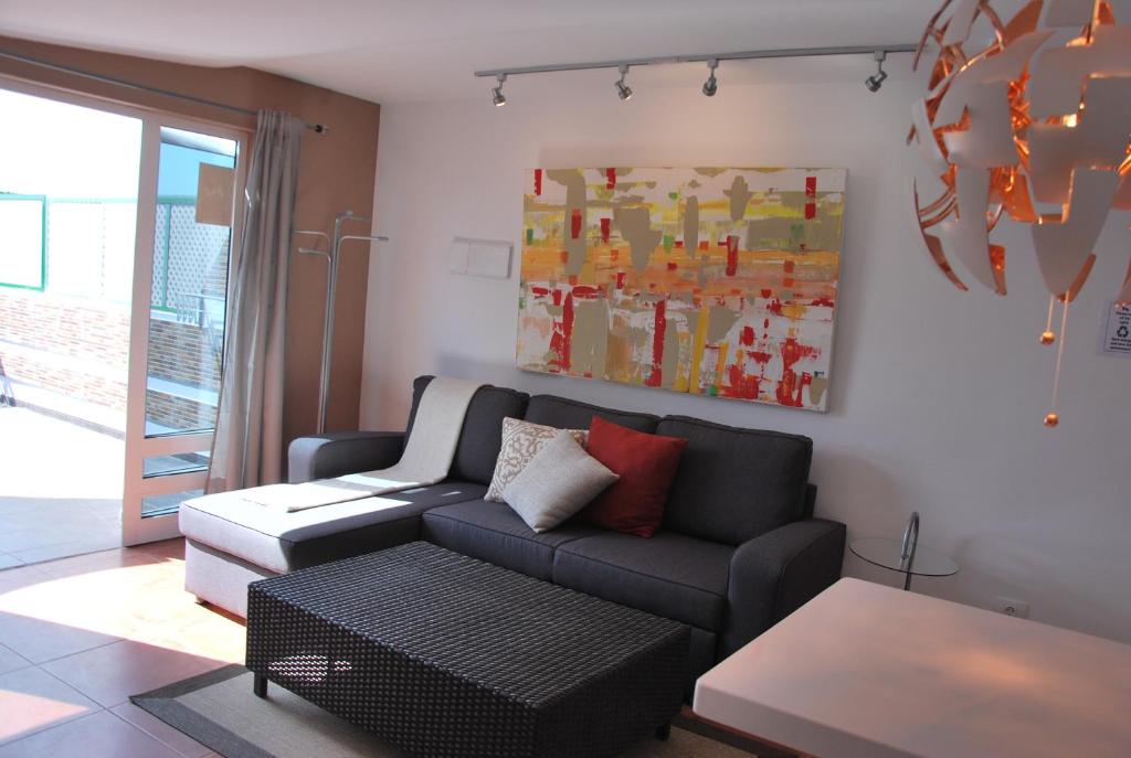 Posezení v ubytování Lacy Golf Apartments