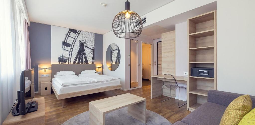Postel nebo postele na pokoji v ubytování roomz Vienna Prater