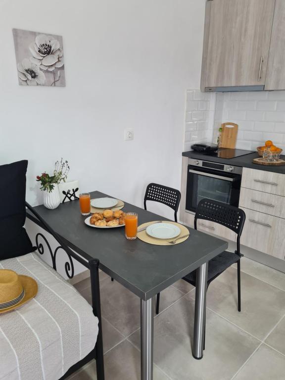 Kuchyň nebo kuchyňský kout v ubytování Olivar Suites