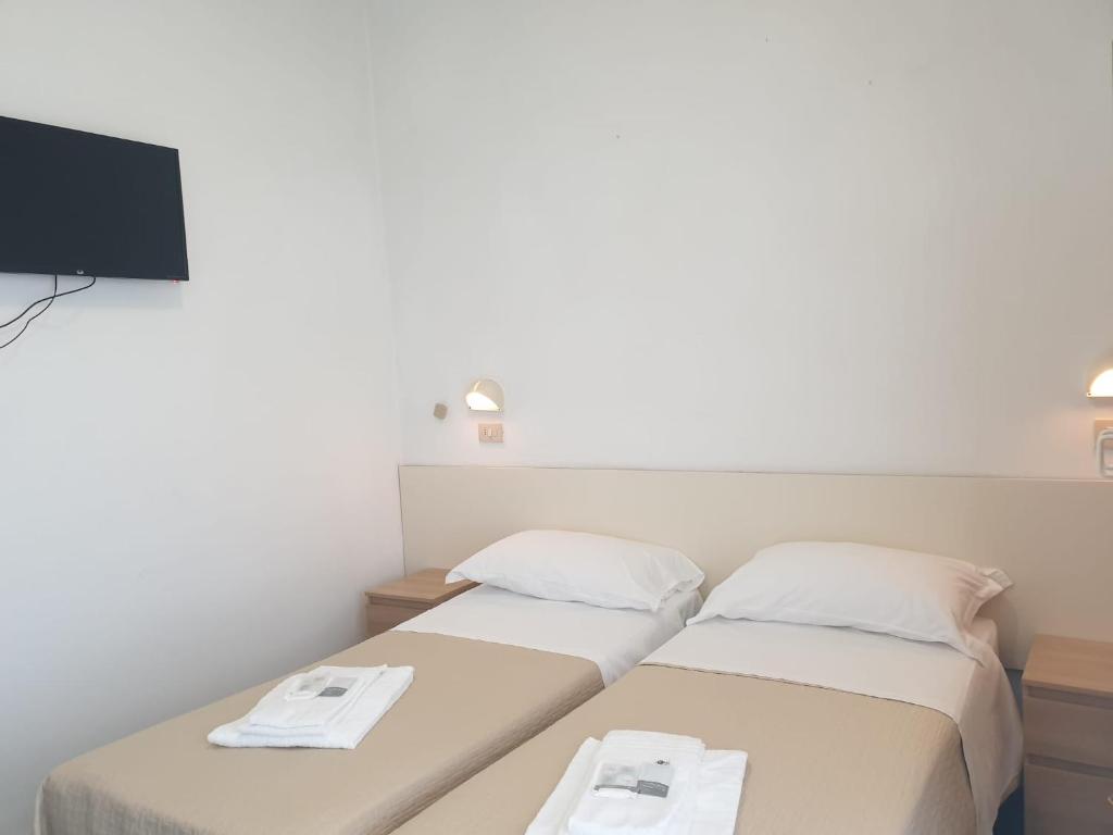 Postel nebo postele na pokoji v ubytování Hotel Baden Baden