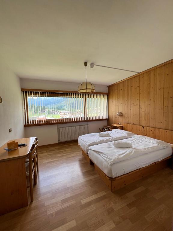 Postel nebo postele na pokoji v ubytování Hotel D'La Varda