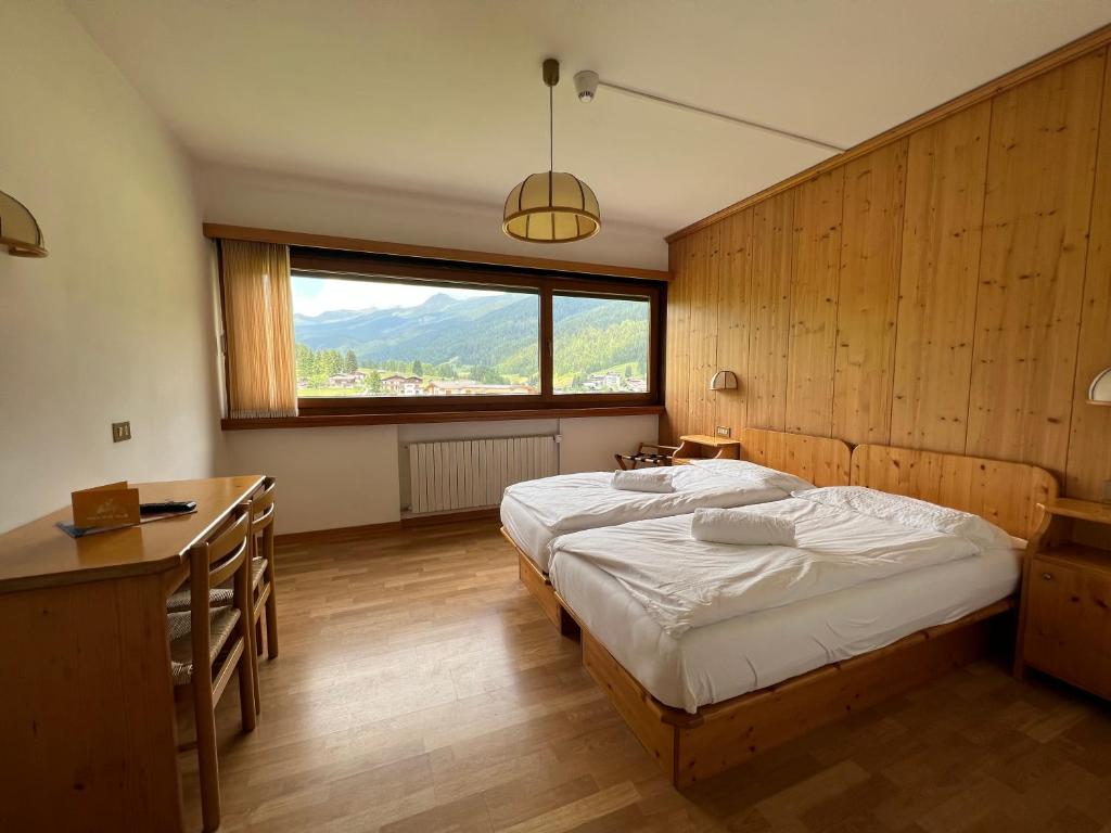 Postel nebo postele na pokoji v ubytování Hotel D'La Varda