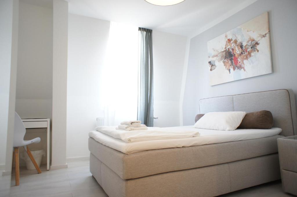 Postel nebo postele na pokoji v ubytování Hotel Böke Rheinfelden