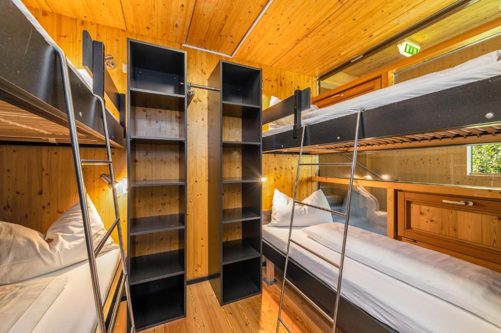 Voodi või voodid majutusasutuse Holzboxen Planneralm toas
