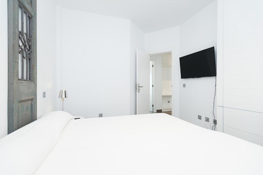 Postel nebo postele na pokoji v ubytování Altos de la Gloria Beach Apartments