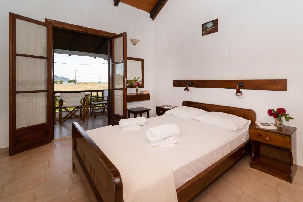 Postel nebo postele na pokoji v ubytování Ilias Apartments