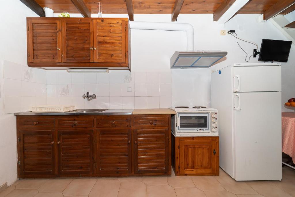 Kuchyň nebo kuchyňský kout v ubytování Ilias Apartments