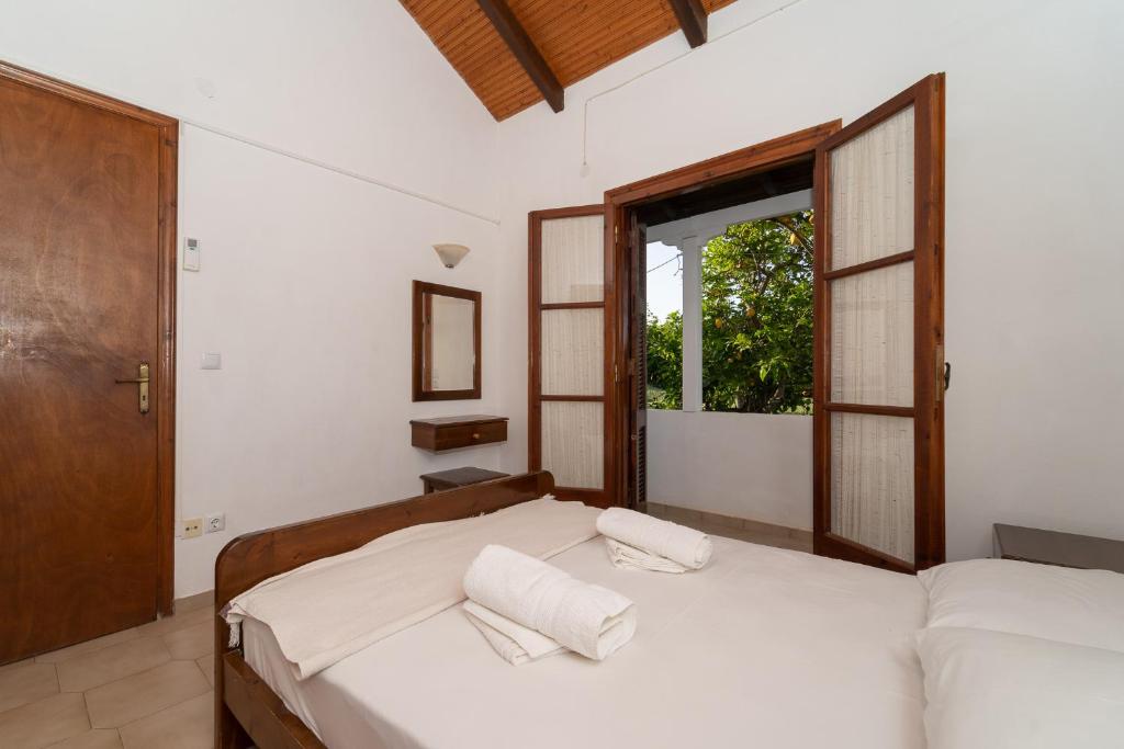 Postel nebo postele na pokoji v ubytování Ilias Apartments