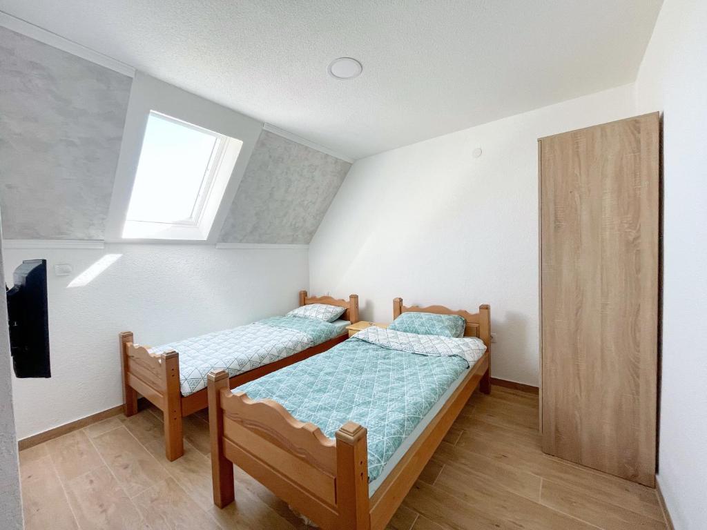 Postel nebo postele na pokoji v ubytování Gorštak