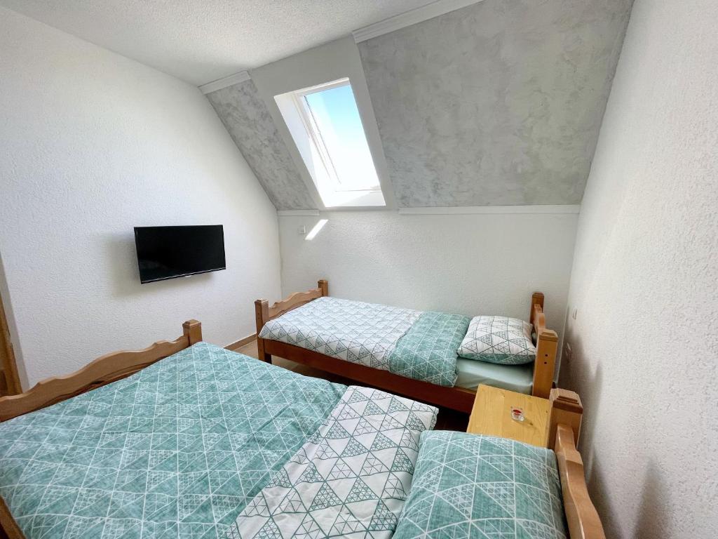 Postel nebo postele na pokoji v ubytování Gorštak