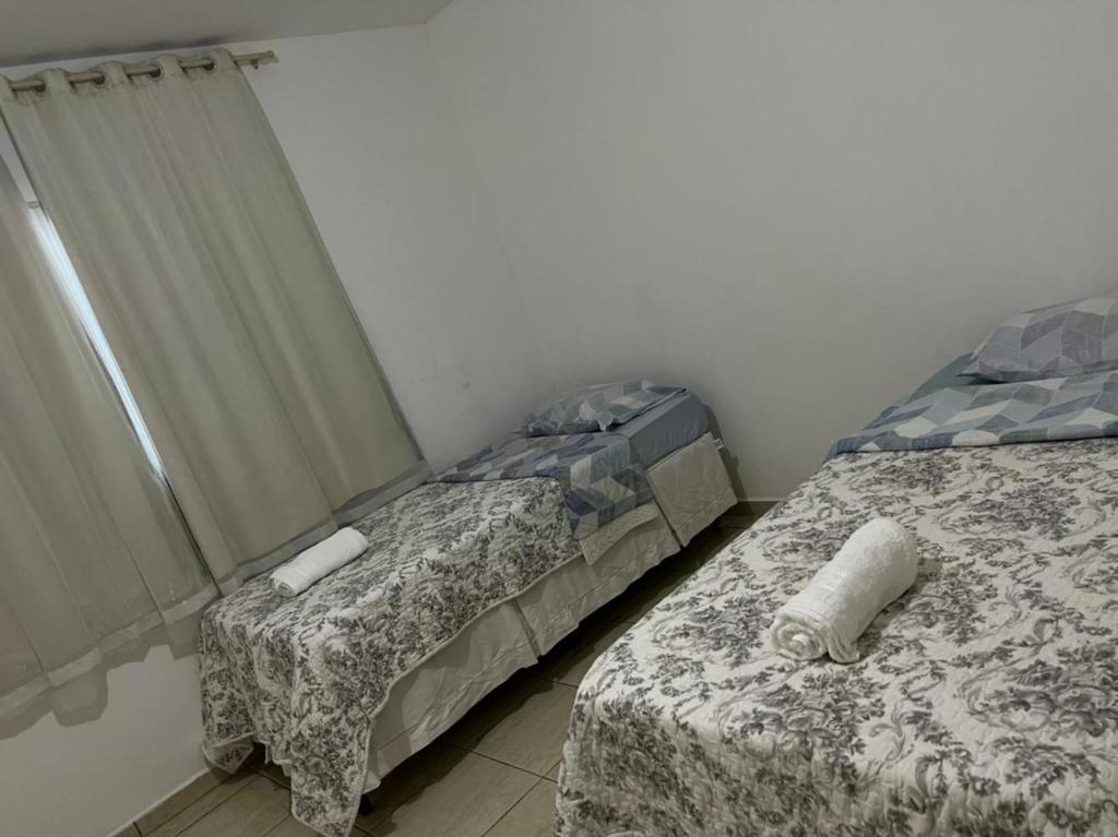 two beds sitting next to each other in a room at CASA SANTA TERESA a in Santa Teresa