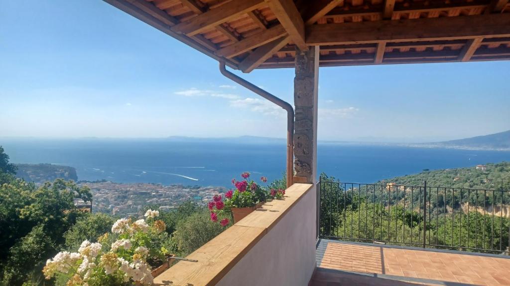 a balcony with a view of the ocean at Agriturismo Primaluce in Sorrento