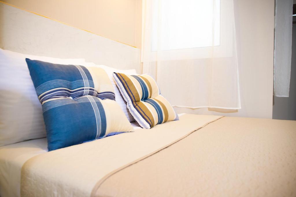 Postel nebo postele na pokoji v ubytování Praxitelis Luxury Apartments