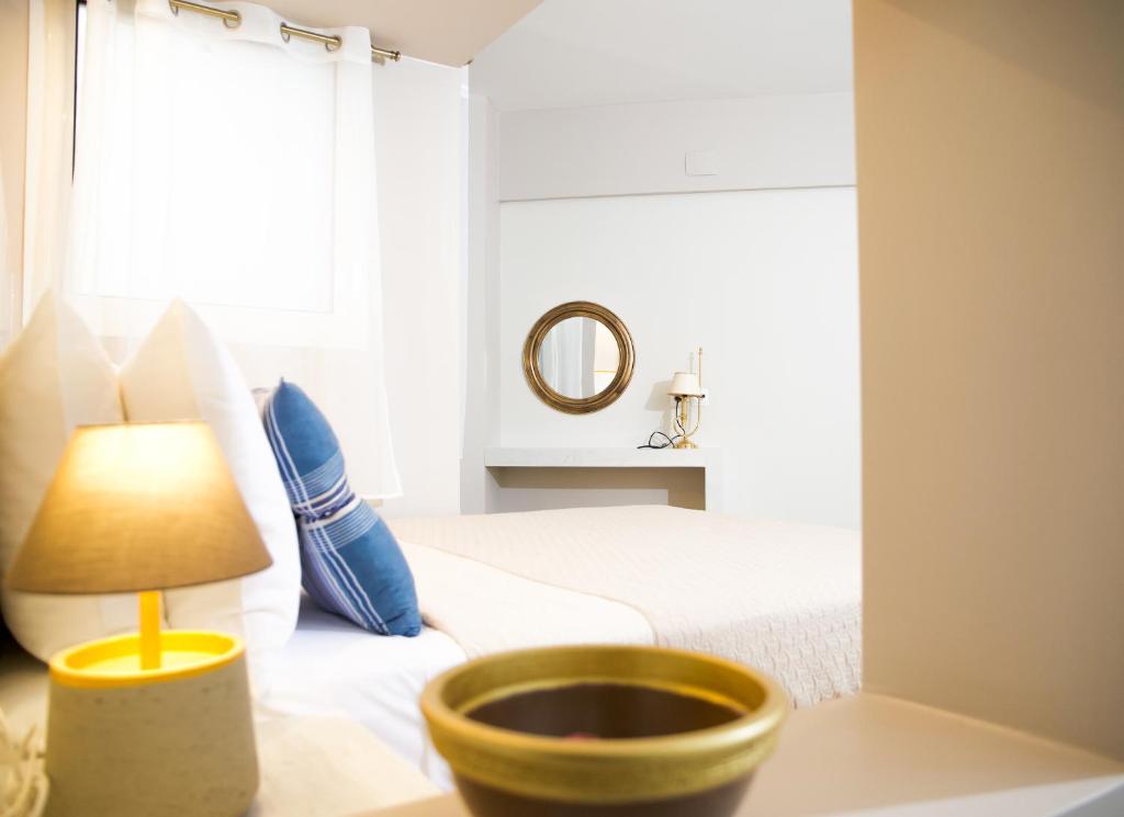 Postel nebo postele na pokoji v ubytování Praxitelis Luxury Apartments