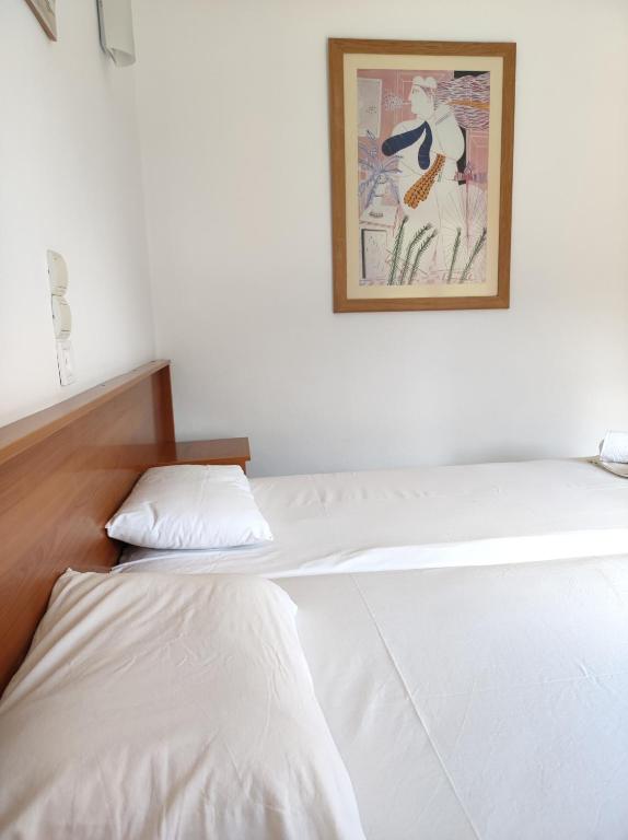 Postel nebo postele na pokoji v ubytování Hotel Ritsa