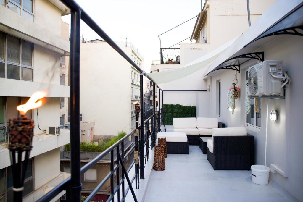 TV a/nebo společenská místnost v ubytování Praxitelis Luxury Apartments