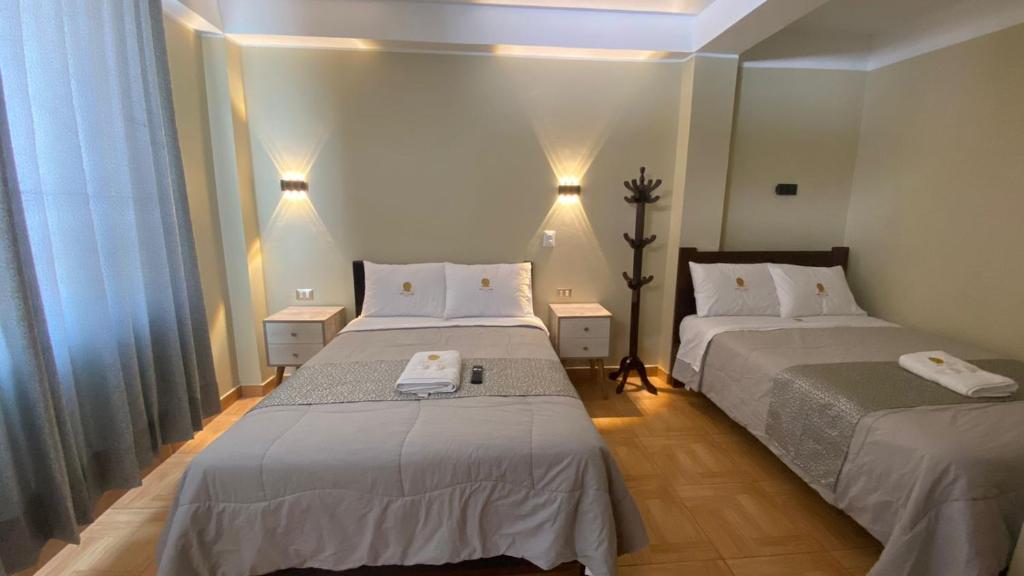 Postel nebo postele na pokoji v ubytování HOTEL MAR Y LAGO