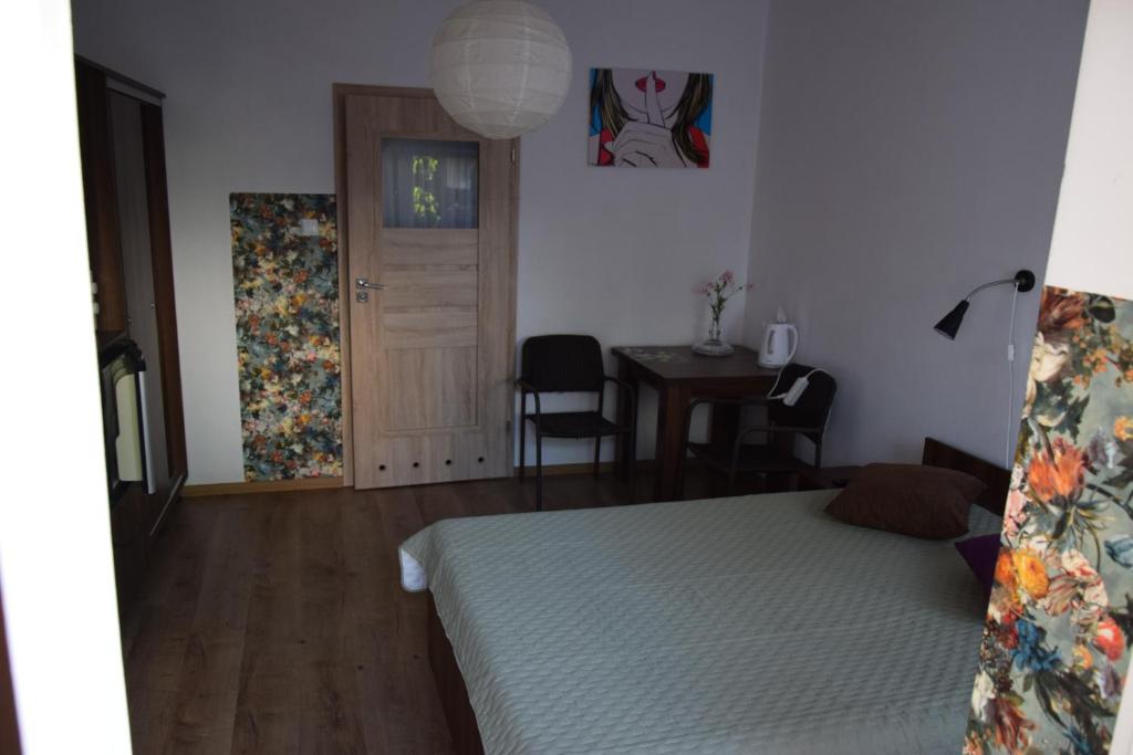 Łóżko lub łóżka w pokoju w obiekcie Willa Baron