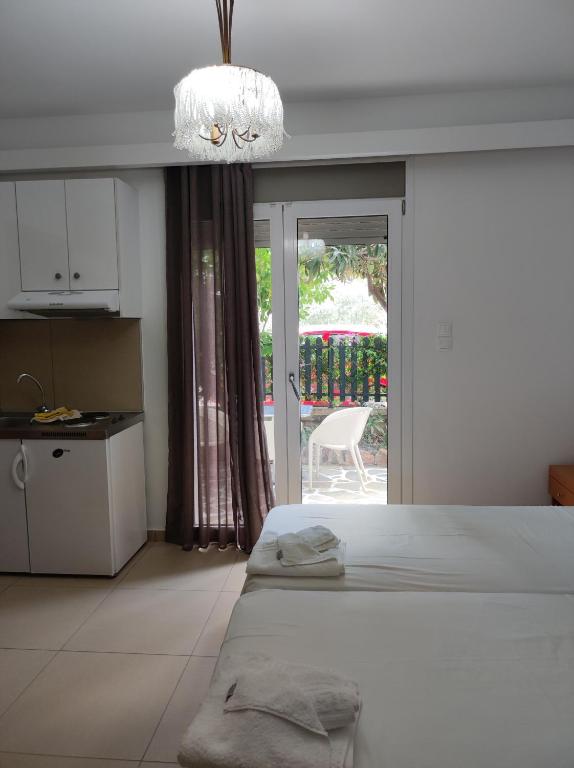 Postel nebo postele na pokoji v ubytování Hotel Ritsa