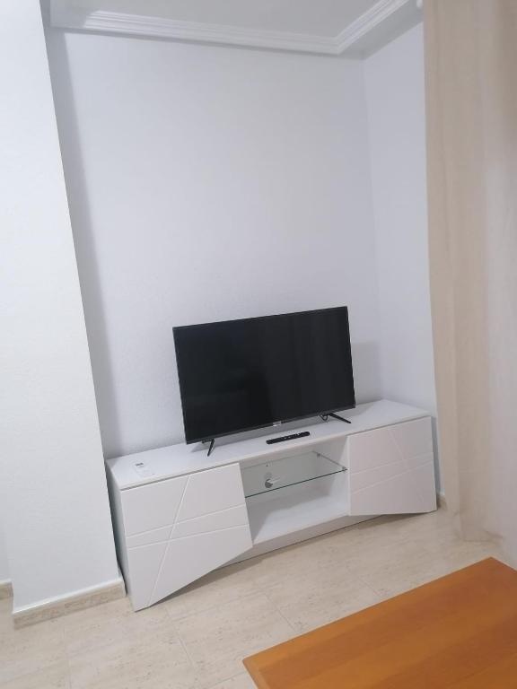 Televízia a/alebo spoločenská miestnosť v ubytovaní Schöne Ferienwohnung in Playa del Cura