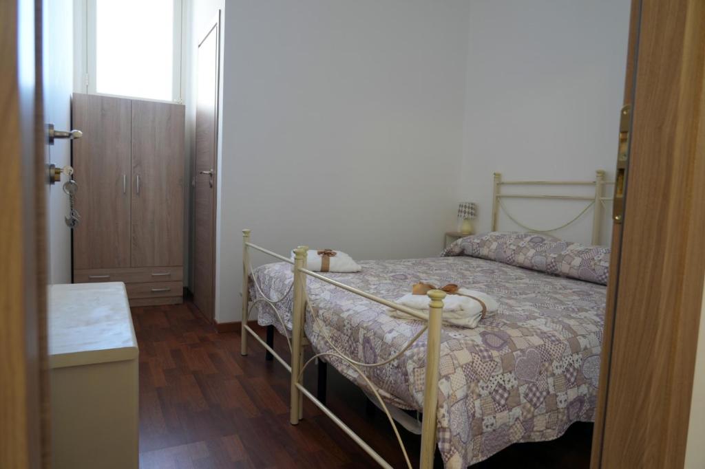 Posteľ alebo postele v izbe v ubytovaní L'Albero bello Holiday