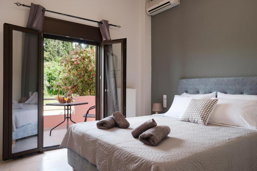 Ένα ή περισσότερα κρεβάτια σε δωμάτιο στο Mouzakitis Apartments 3