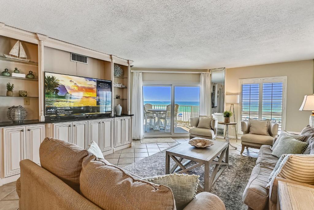 a living room with a couch and a tv at Inlet Reef 205 Destin Apts in Destin