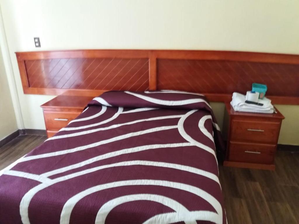 Postel nebo postele na pokoji v ubytování HOTEL RESTAURANT LOS PRISMAS