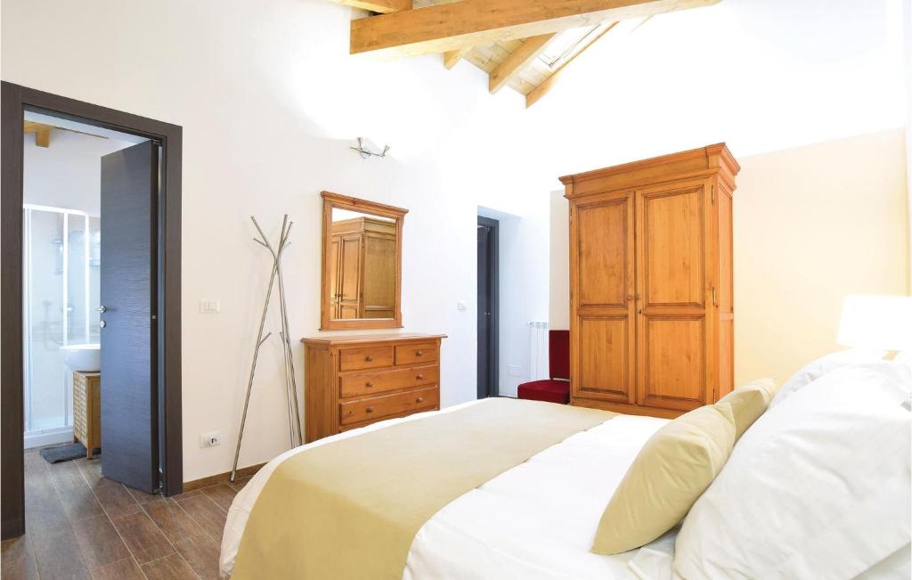 A bed or beds in a room at La Casina De Papou