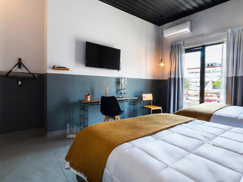 Ένα ή περισσότερα κρεβάτια σε δωμάτιο στο Hotel NEXT