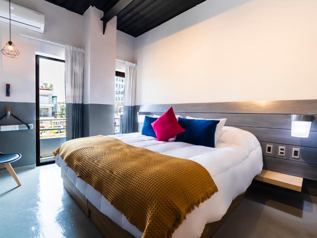Ένα ή περισσότερα κρεβάτια σε δωμάτιο στο Hotel NEXT