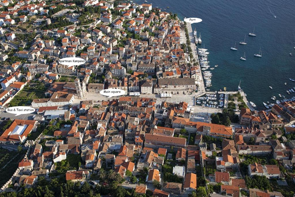 an aerial view of a town next to the water at Apartments and Rooms Kampanel in Hvar
