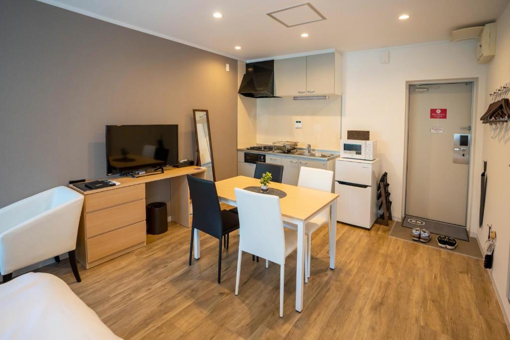 Kuchyň nebo kuchyňský kout v ubytování HOTEL R9 The Yard Honjo