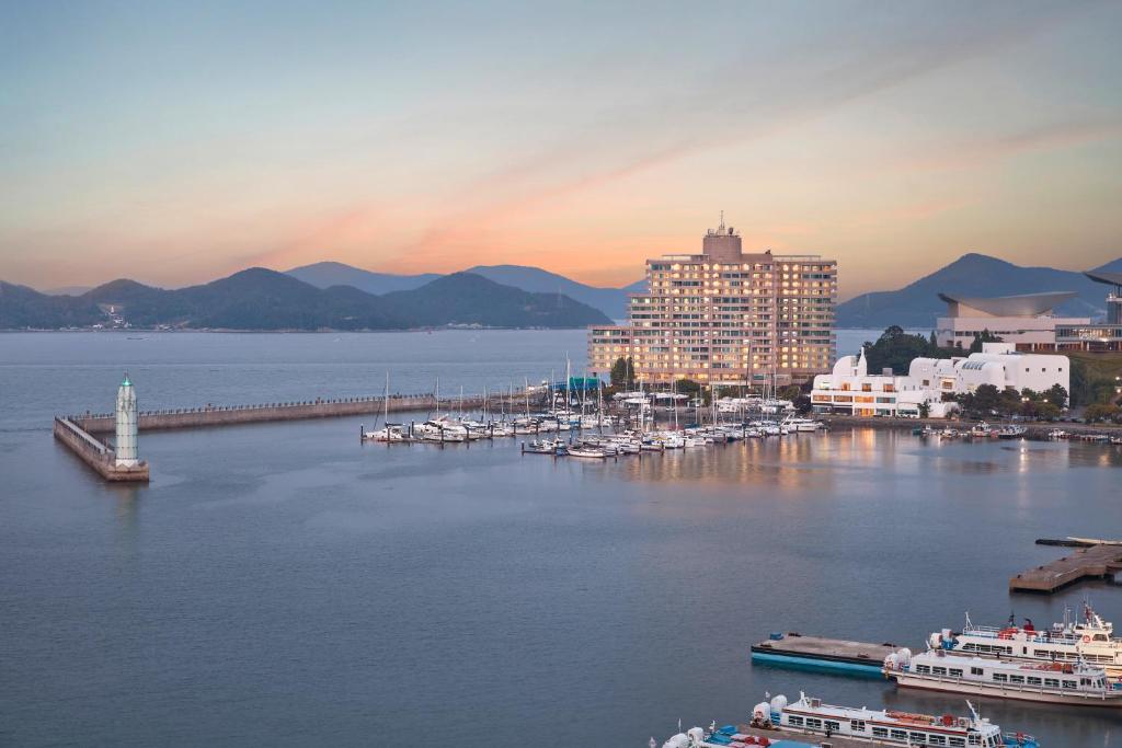 a view of a harbor with boats in the water at Kumho Tongyeong Marina Resort in Tongyeong