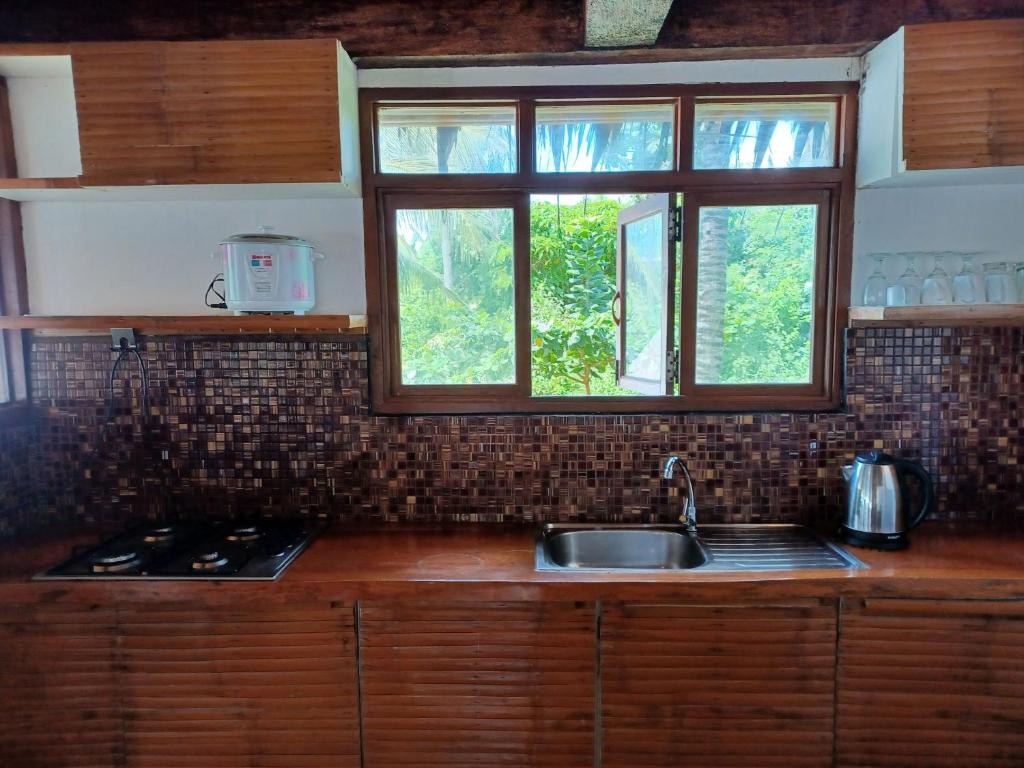 Kuchyň nebo kuchyňský kout v ubytování Paras Inn Boracay