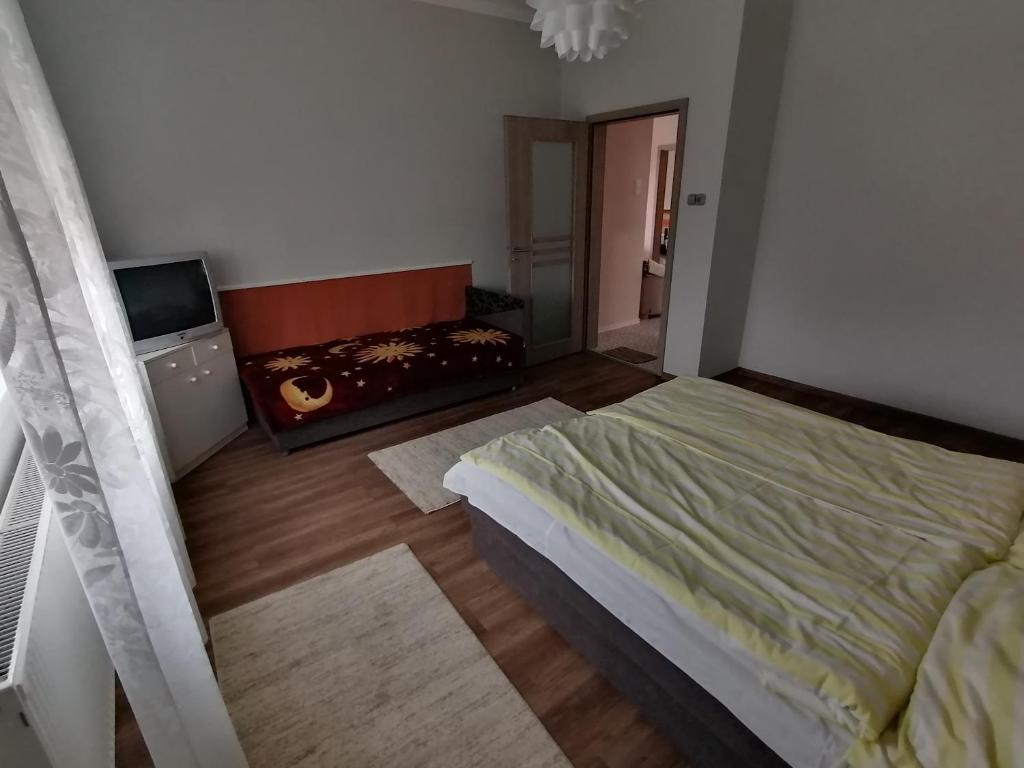 Postel nebo postele na pokoji v ubytování Apátságúti Vendégház