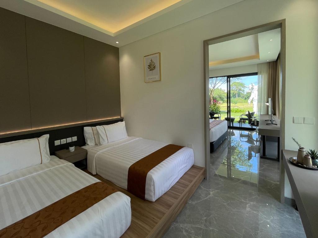 Postel nebo postele na pokoji v ubytování The Valerian Villa Ubud