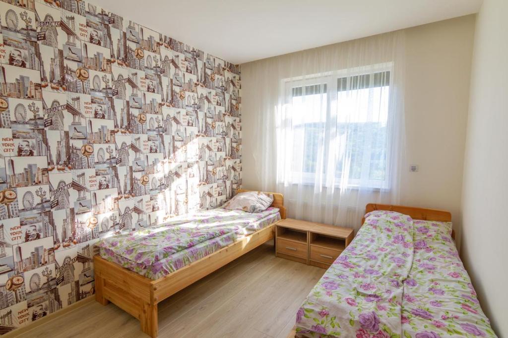 Postel nebo postele na pokoji v ubytování Садиба під Лісом