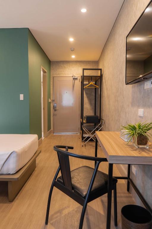 Postel nebo postele na pokoji v ubytování Primeway Suites Cebu