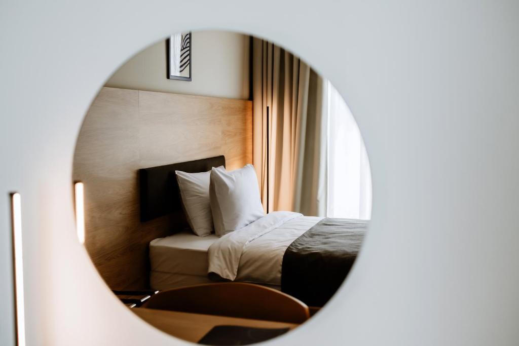 Postel nebo postele na pokoji v ubytování Hotel Septembar