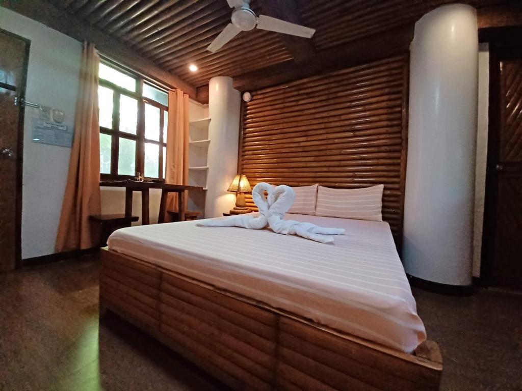 Postel nebo postele na pokoji v ubytování Paras Inn Boracay