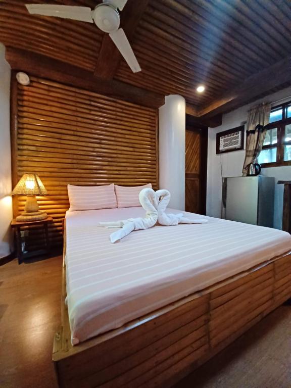 Postel nebo postele na pokoji v ubytování Paras Inn Boracay
