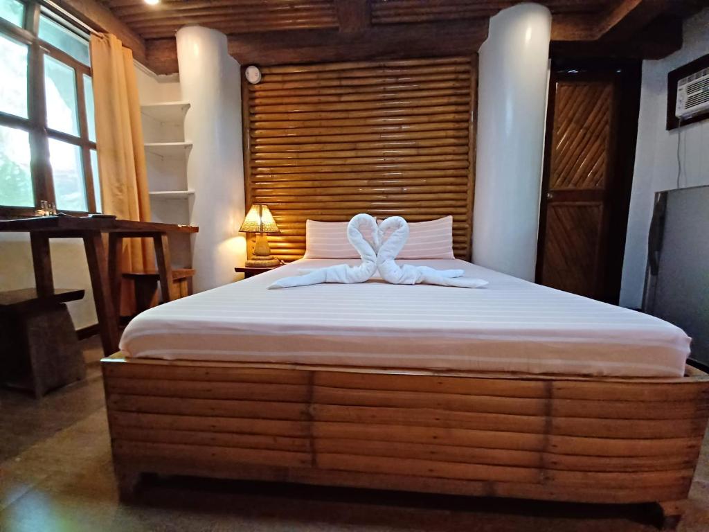 Postel nebo postele na pokoji v ubytování Paras Inn Boracay