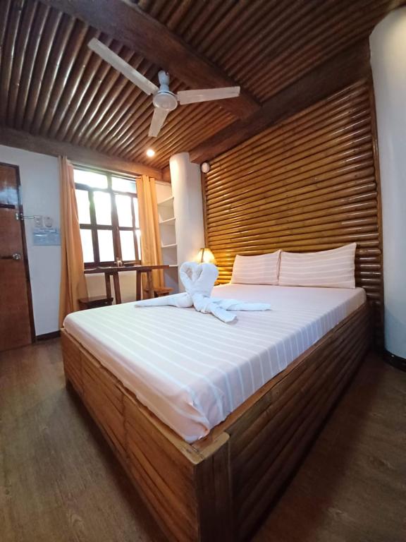 Postel nebo postele na pokoji v ubytování Paras Inn Boracay