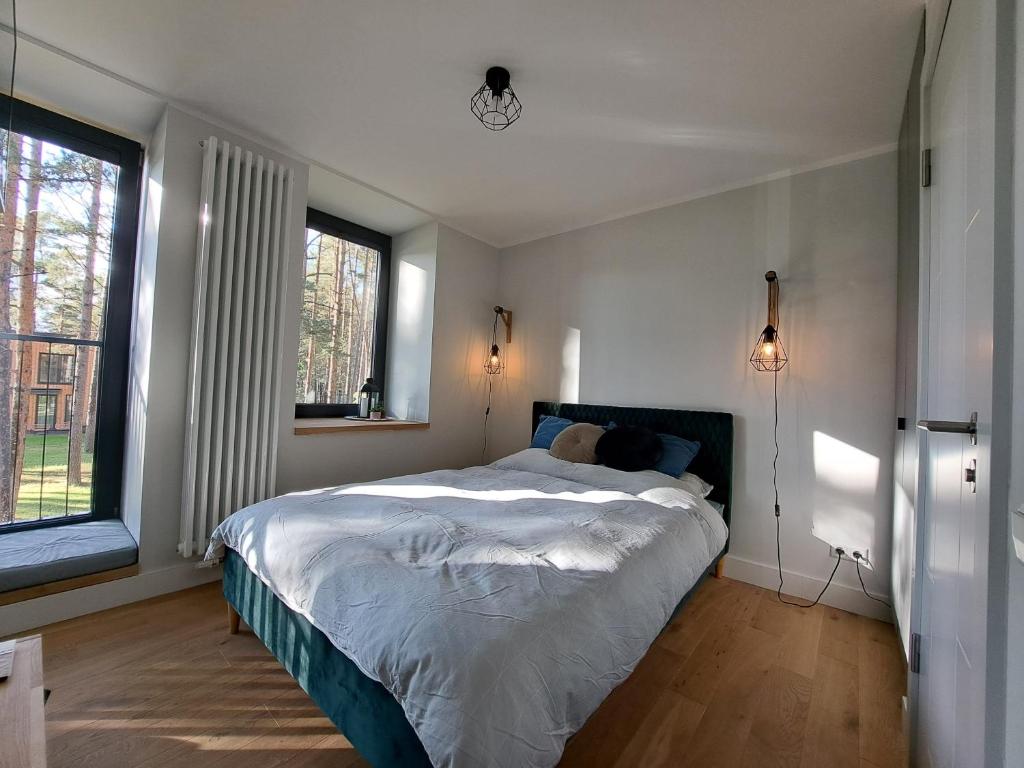 מיטה או מיטות בחדר ב-Seaside Apartment at Albatross resort
