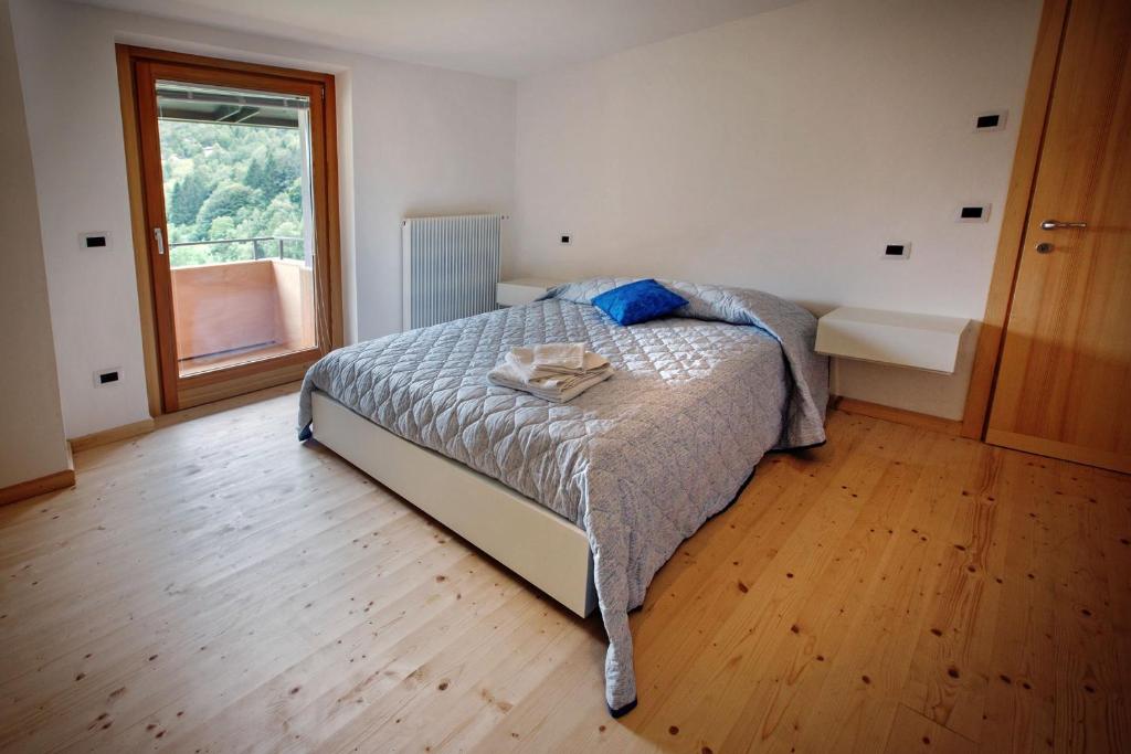 Postel nebo postele na pokoji v ubytování La Marmote Albergo Diffuso di Paluzza Aip