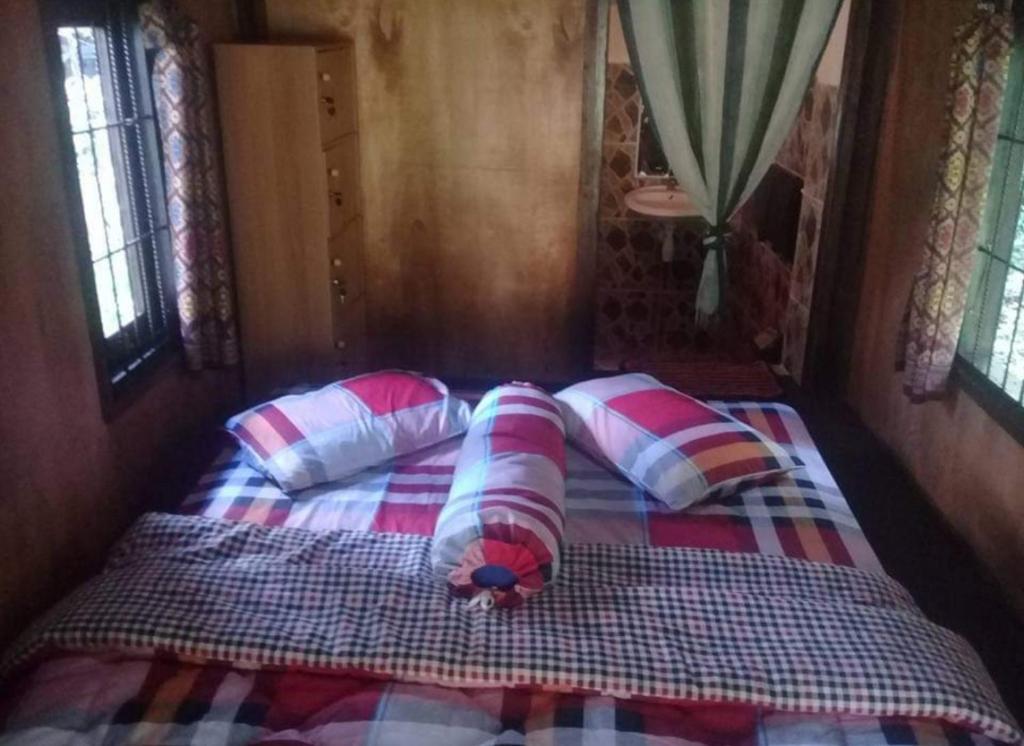 Postel nebo postele na pokoji v ubytování Sky garden Lombok