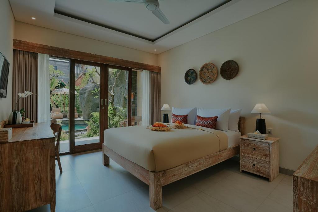 Postel nebo postele na pokoji v ubytování LASTANA SUITE UBUD