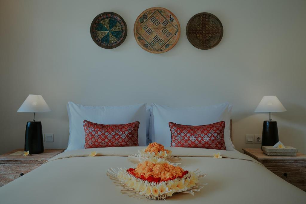 Postel nebo postele na pokoji v ubytování LASTANA SUITE UBUD